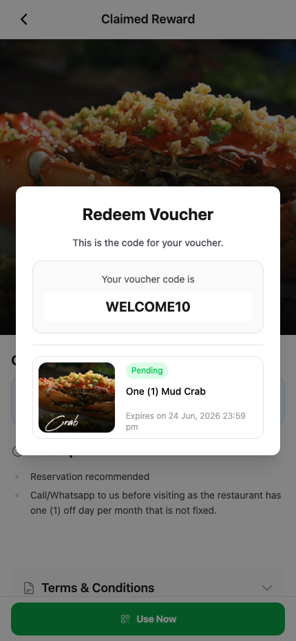 Customer portal Redeem Voucher screen showing the voucher code the customer presents to staff at the counter, with the reward name and expiry below